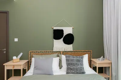 a bedroom with a bed with black and white pillows at Elite Escape Holiday Home - 2 BHK Getaway with Dubai Mall Access - 1508 in Dubai