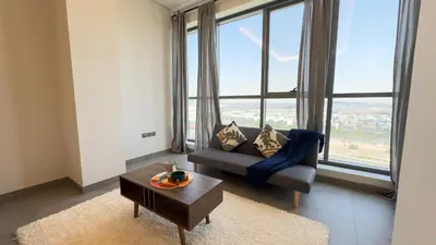 a living room with a couch and a table at Private Studio Burj Khalifa Area -BEST PRICE in Dubai