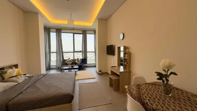 a bedroom with a bed and a living room at Private Studio Burj Khalifa Area -BEST PRICE in Dubai