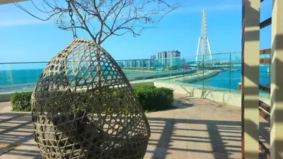 a large metal vase with a tree in it at Luxurious Marina & Sea views 1BR near Blue Waters Dubai Marina By Maxx Value Homes in Dubai