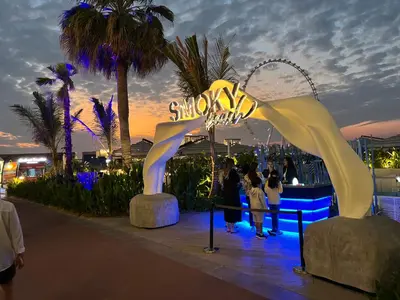 a group of people standing in front of a roller coaster at 1 BR Flat, Luxury amenities, Near JBR Beach & Club with FREE Parking in JBR in Dubai