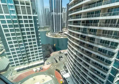 an aerial view of a city with tall buildings at HAVN - Studio Apartment in JLT, with Lake Views in Dubai