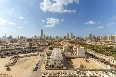 an aerial view of a city with tall buildings at Luxury Living in 1 bedroom apartment in JVC in Dubai