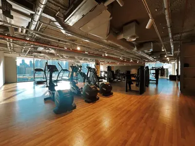 a gym with treadmills and ellipticals in a room at Downtown Views II Burj Khalifa View, Downtown Dubai - Mint Stay in Dubai