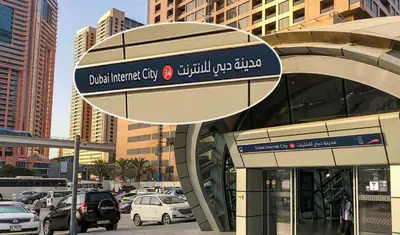 a sign on the side of a building in a city at Blooming Partition Room in Tecom Near Internet City Metro in Dubai