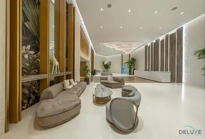 a large living room with couches and a table at Special Offer Stylish 1BR with Scenic Views & Pool by Deluxe Holiday Homes in Dubai