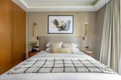 a bedroom with a large white bed in it at GuestReady - Contemporary delight in Dubai in Dubai