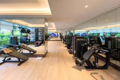 a gym with treadmills and cardio equipment in a building at GuestReady - Contemporary delight in Dubai in Dubai