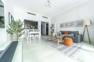 a living room with a couch and a table at Frank Porter - Torch Tower in Dubai