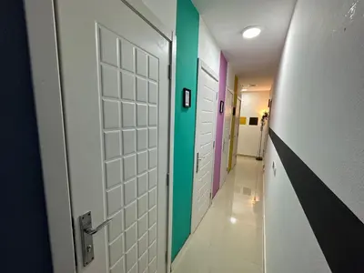 a hallway with colorful doors and a corridorngth at Prime Partition Room in Al Barsha 1 Near Metro in Dubai