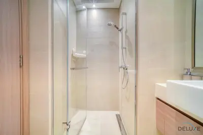 a bathroom with a shower and a sink at Pleasant Studio Apartment at Azizi Riviera 13, Al Merkadh by Deluxe Holiday Homes in Dubai
