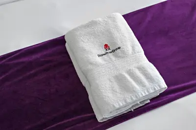 a white sock on top of a purple blanket at Summer offer! All Inclusive! Prime Location in Dubai