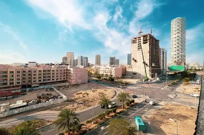 a view of a city with tall buildings at Spacious Balcony, King Bed, Pool at JVC Dubai in Dubai