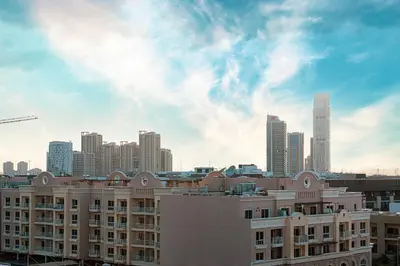 a view of a city skyline with a building at Spacious Balcony, 1BR, Pool, Full Kitchen at JVC in Dubai
