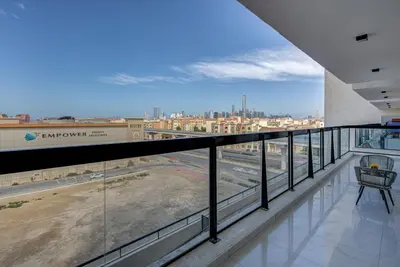 a balcony with a view of a construction site at Mira Holiday Homes -Newly 2 bedroom close to metro. in Dubai