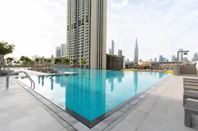 a large swimming pool on the roof of a building at Stunning 2 Bedroom Apartment with Burj Views by Zen Stays - Walking Distance to Dubai Mall in Dubai