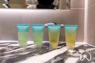 a group of four tasting cups sitting on a counter at Oraya - Paramount Midtown Luxurious 2BR with Sea View in Dubai