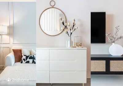 a living room with a white dresser and a mirror at 2ndHome - Address Beach Resort, Tower 1, JBR in Dubai