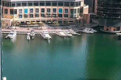 a group of boats docked in a harbor in a city at Salt of the Ocean in JBR by Lagom in Dubai