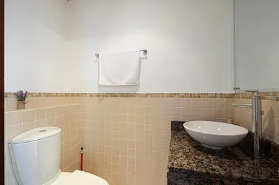 a bathroom with a toilet and a sink at Salt of the Ocean in JBR by Lagom in Dubai