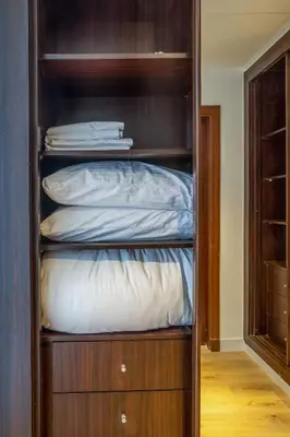 a wooden closet with a bed in it at Deluxe - Sea view - Dubai Marina in Dubai