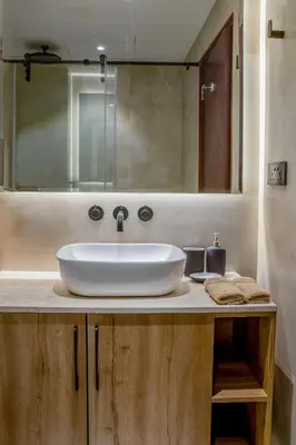 a bathroom with a white sink and a mirror at Deluxe - Sea view - Dubai Marina in Dubai