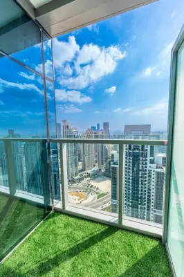 a balcony with a view of the city at The Cinephile Burj Khalifa View 2BR Dubai in Dubai