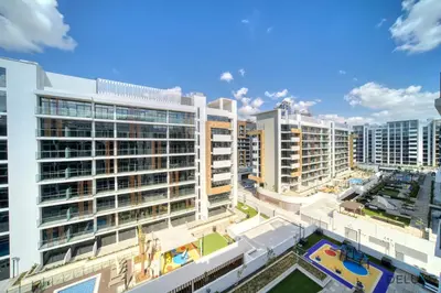 an aerial view of a city with tall buildings at Serene 1BR Apartment in Azizi Riviera 27, Al Merkadh by Deluxe Holiday Homes in Dubai