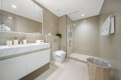 a bathroom with a sink and a toilet and a shower at **Panoramic Views Of Burj Khalifa and Fountain** in Dubai