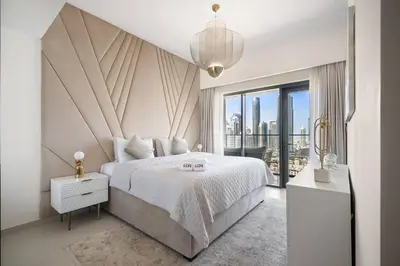 a bedroom with a large bed and a large window at **Panoramic Views Of Burj Khalifa and Fountain** in Dubai
