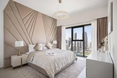 a bedroom with a large bed and a large window at *Views of Burj Khalifa Fountain* in Dubai