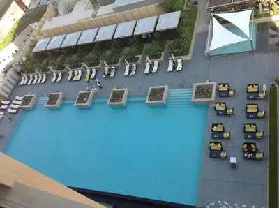 an overhead view of a swimming pool with chairs at Suitestay-Formerly Address Dubai Mall Residence-Downtown in Dubai