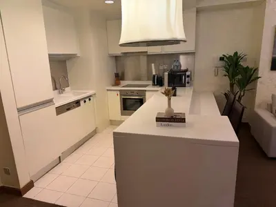 a kitchen with a white counter top in a room at Emaar Residence Fashion Avenue - formerly Address Dubai Mall in Dubai