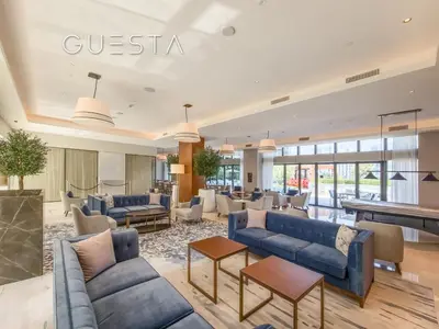 a lobby with couches and a pool table at Address Residences Dubai Opera, Downtown Dubai in Dubai