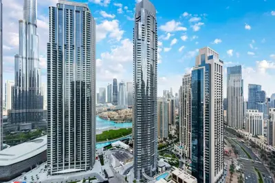 a city skyline with tall skyscrapers in a city at FAM Living - Modern 3 Beds+Maidroom Home in Downtown Burj view in Dubai