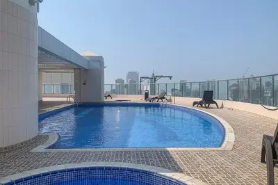 a swimming pool on the roof of a building at Frank Porter - Al Waleed Paradise in Dubai