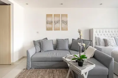 a living room with a couch and a table at Frank Porter - Al Waleed Paradise in Dubai