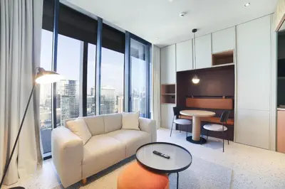 a living room with a couch and a table at Studio with Burj Khalifa View - Upside Living in Dubai