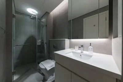 a bathroom with a sink and a shower at Ahad Residences Studio- 15mins walk to Dubai Mall in Dubai
