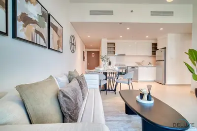 a living room with a couch and a table at Exquisite 1BR at Downtown Views II Tower 2 Downtown Dubai by Deluxe Holiday Homes in Dubai