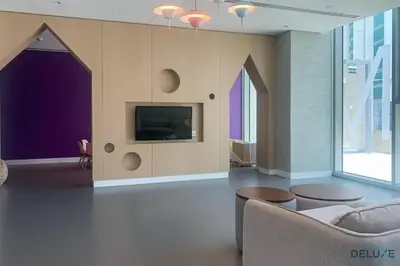 a living room with a couch and a tv at Exquisite 1BR at Downtown Views II Tower 2 Downtown Dubai by Deluxe Holiday Homes in Dubai