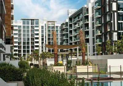 a view of a city with tall buildings at 1BR Gem with Pool 15 Mins to Downtown Dubai in Dubai