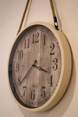 a clock hanging on a wall at Dubaistay Luxury 2 Bedroom holiday appartment JVC KING and QUEENSIZE in Dubai