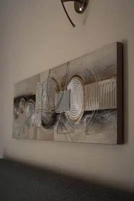 a painting hanging on a wall at Dubaistay Luxury 2 Bedroom holiday appartment JVC KING and QUEENSIZE in Dubai