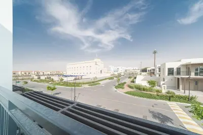 a view from a balcony of a street with buildings at Luxurious 3 BR with Maid Room in Arabian Ranches 2 in Dubai