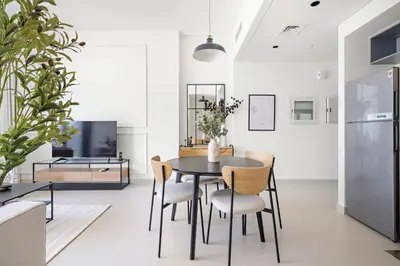 a dining room with a table and chairs at Silkhaus Comfy 1BR by Burj Khalifa with Balcony in Dubai