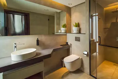 a bathroom with a sink and a toilet at Nas House Private & Shared Villas in Dubai