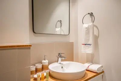a bathroom with a sink and a mirror at Homesgetaway Luxury 2BR at Socio Dubai hills in Dubai