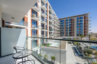 an apartment balcony with a view of a building at Gorgeous Studio Apartment in DAMAC Celestia B Dubai South by Deluxe Holiday Homes in Dubai