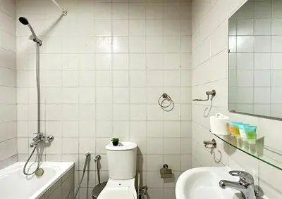 a bathroom with a toilet and a sink at WOW Studio w/ Balcony and Canal View in Marina in Dubai